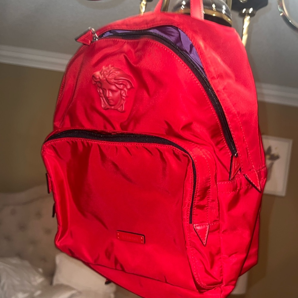 Red backpack with matching pouch (cards and duffle bag included)